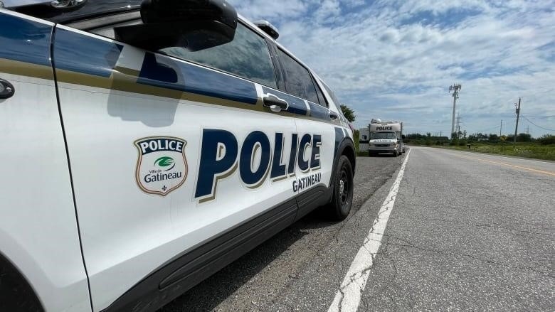 A Gatineau police car parked on the side of the road.