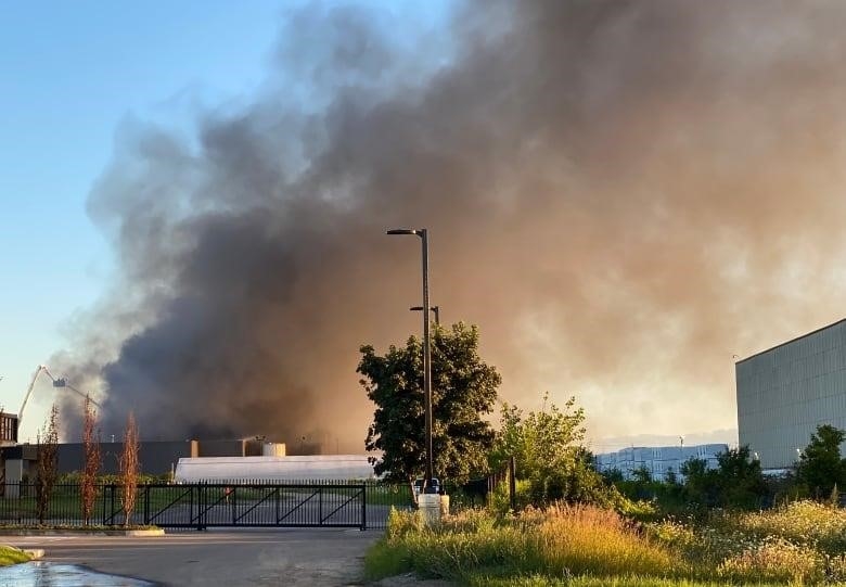 Thick smoke billowing from the scene of the blaze on Vulcan Street in Etobicoke.