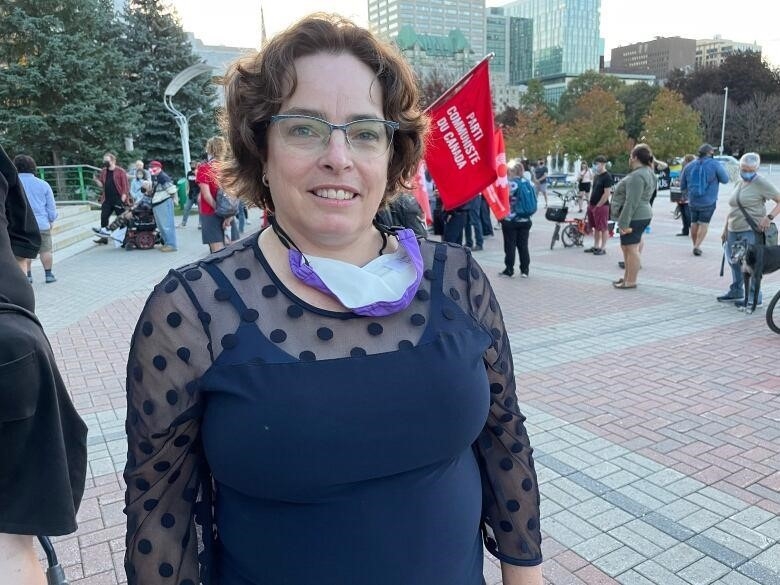 A woman stands on a street in Ottawa 