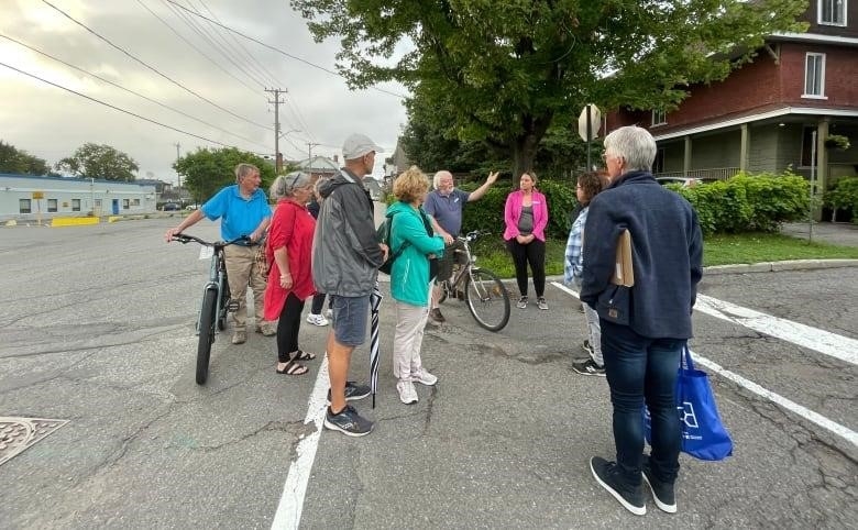 Vanier residents who came out for the 'Good Neighbours' safety walk discuss issues in their neighbourhood. 