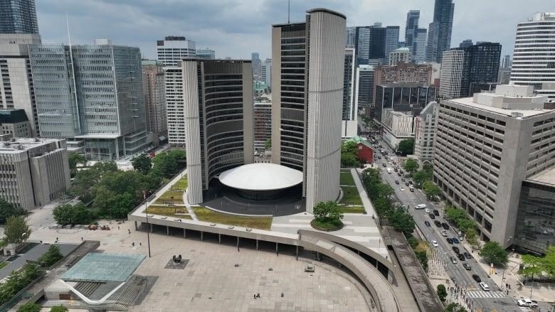 Aerial (drone) images of City of Toronto City Hall and Nathan Phillip's Square in springtime